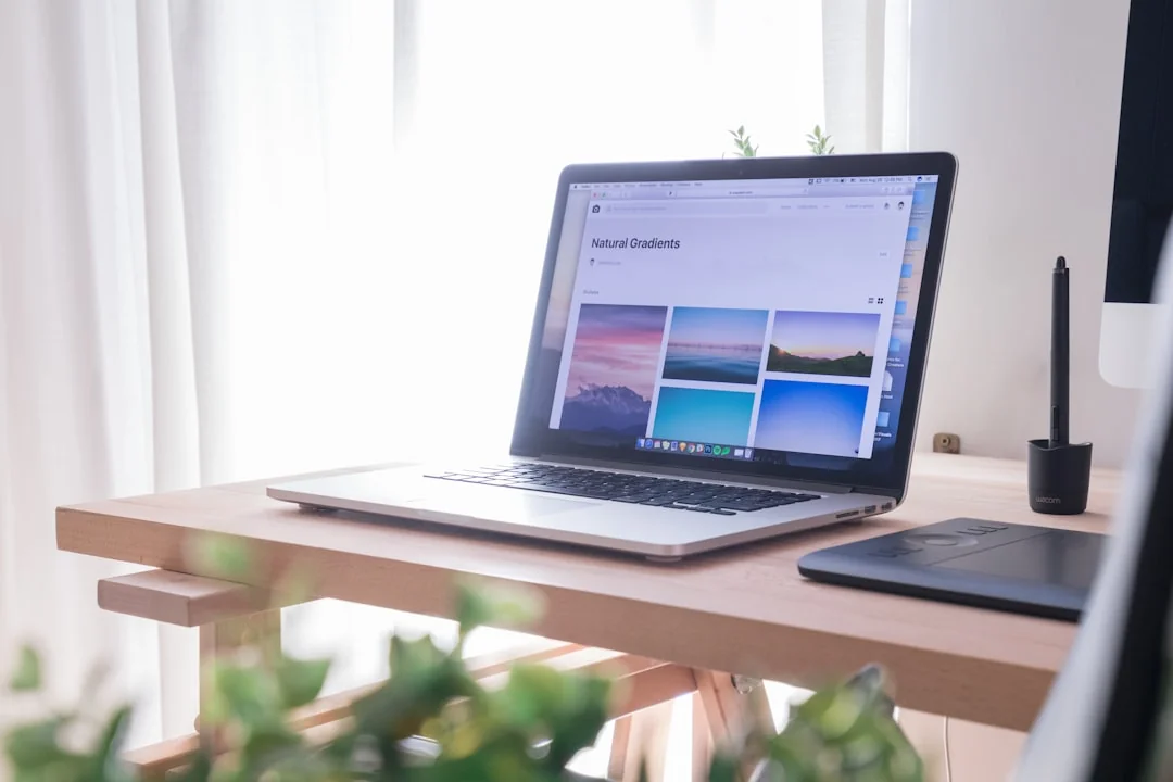 High-angle view of a stylish work desk featuring dual monitors, keyboard, mouse, and modern accessories.